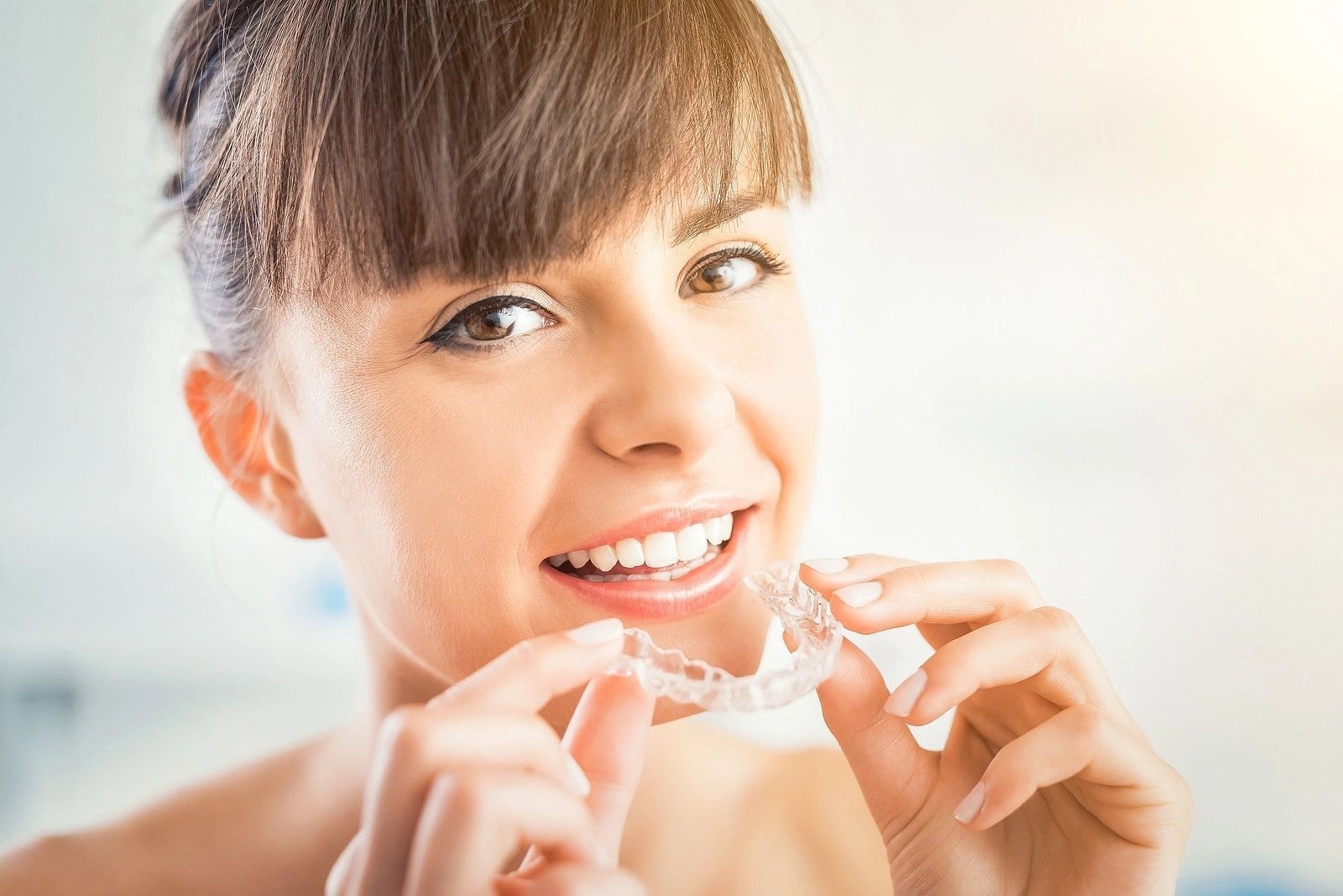 Patient holding a custom oral appliance